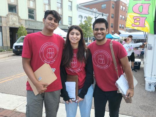 Beloit College students Aaditya Joshi, Laraib Irfan, and Prince Upadhyay working during the summer with Belmark Associates.