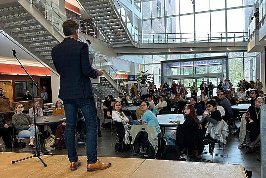 Tim Leslie speaks to students at the launch party for the Schools of Environment & Sustainability and Media & Arts.