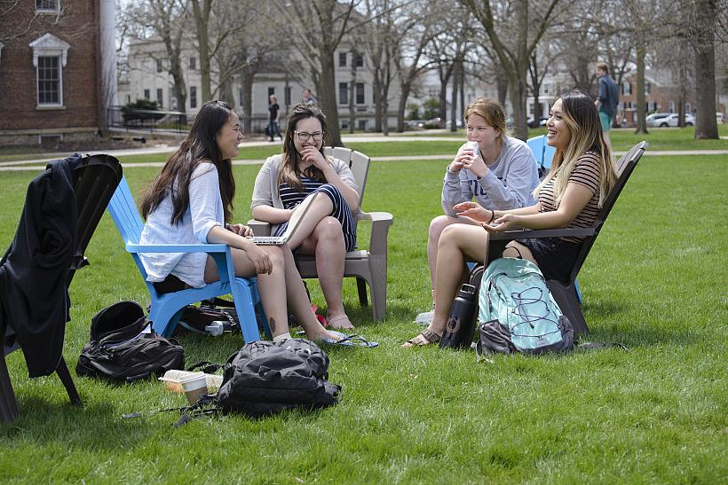 Brightly colored plastic Adirondack chairs, arranged in small circular groupings, appeared on campus one morning late last spring.